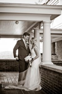 Bride and Groom look at each other and laugh